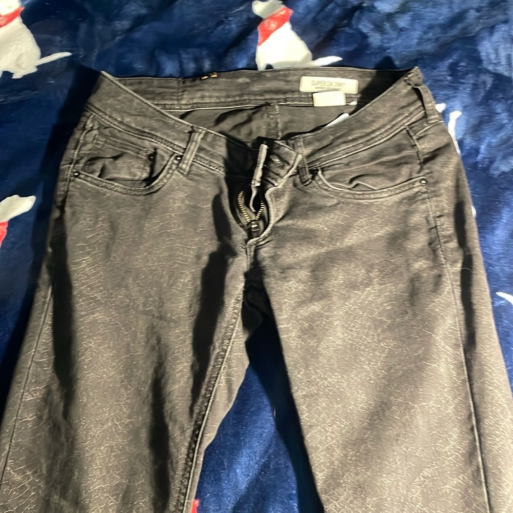 Black snake skin print skinny, low waist jeans